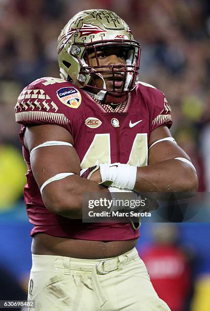 DeMarcus Walker of the Florida State Seminoles reacts in the first half against the Michigan Wolverines during the Capitol One Orange Bowl at Sun...