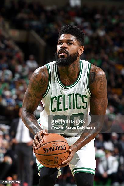 Amir Johnson of the Boston Celtics shoots a free throw during the game against the Miami Heat on December 30, 2016 at the TD Garden in Boston,...