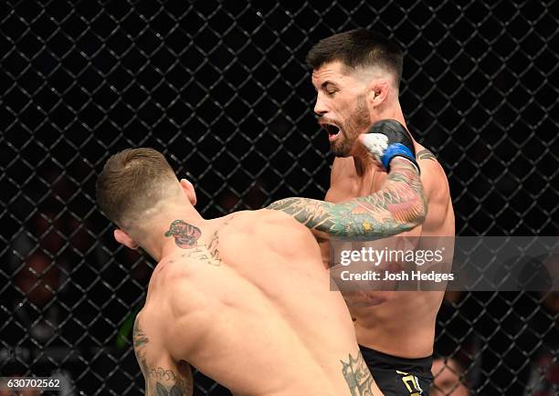 Cody Garbrandt punches Dominick Cruz in their UFC bantamweight championship bout during the UFC 207 event at T-Mobile Arena on December 30, 2016 in...