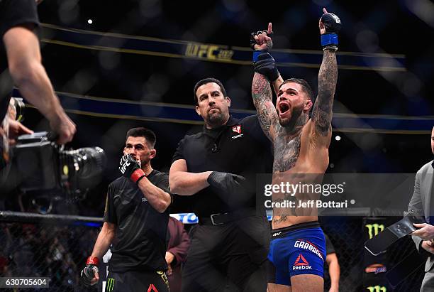 Cody Garbrandt is declared the winner against Dominick Cruz in their UFC bantamweight championship bout during the UFC 207 event at T-Mobile Arena on...