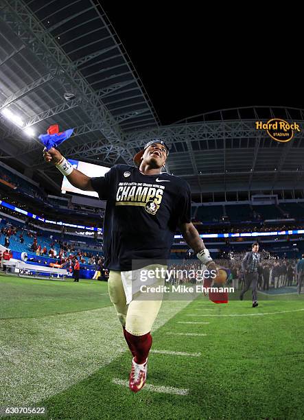 Deondre Francois of the Florida State Seminoles celebrates their 33 to 32 win over the Michigan Wolverines during the Capitol One Orange Bowl at Sun...