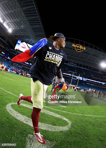Deondre Francois of the Florida State Seminoles celebrates their 33 to 32 win over the Michigan Wolverines during the Capitol One Orange Bowl at Sun...
