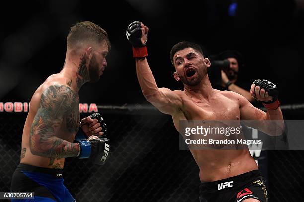 Dominick Cruz punches Cody Garbrandt during the UFC 207 event at T-Mobile Arena on December 30, 2016 in Las Vegas, Nevada.