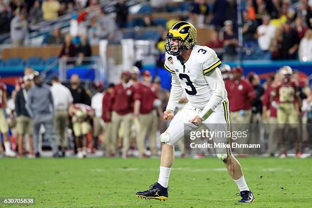 Wilton Speight of the Michigan Wolverines reacts to a two-point conversion in the fourth quarter against the Florida State Seminoles during the...