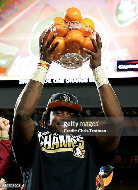 Dalvin Cook of the Florida State Seminoles celebrates their 33 to 32 win over the Michigan Wolverines during the Capitol One Orange Bowl at Sun Life...