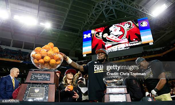 Dalvin Cook of the Florida State Seminoles celebrates their 33 to 32 win over the Michigan Wolverines during the Capitol One Orange Bowl at Sun Life...