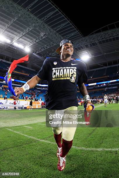 Deondre Francois of the Florida State Seminoles celebrates their 33 to 32 win over the Michigan Wolverines during the Capitol One Orange Bowl at Sun...