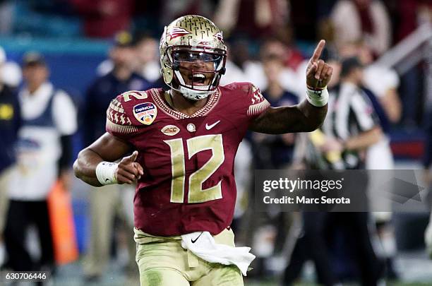 Deondre Francois of the Florida State Seminoles celebrates their 33 to 32 win over the Michigan Wolverines during the Capitol One Orange Bowl at Sun...