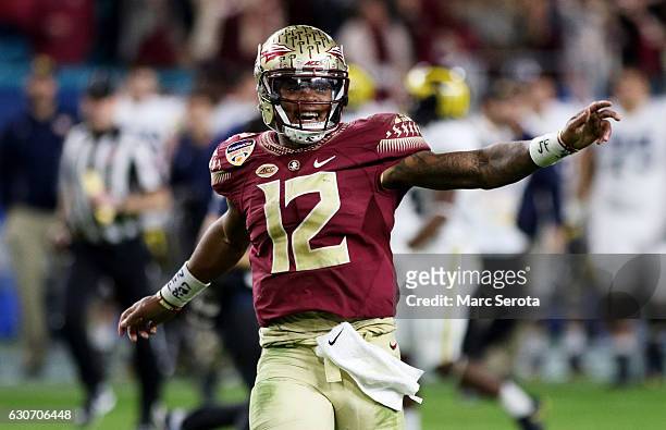 Deondre Francois of the Florida State Seminoles celebrates their 33 to 32 win over the Michigan Wolverines during the Capitol One Orange Bowl at Sun...
