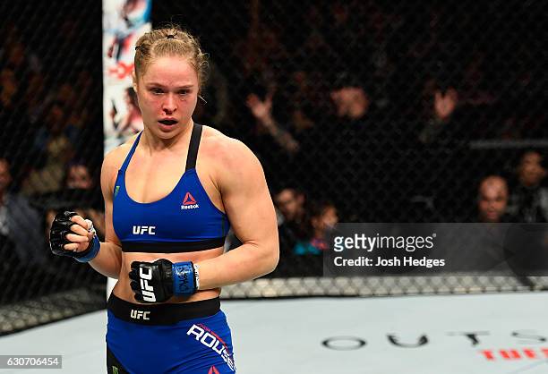 Ronda Rousey reacts to her loss to Amanda Nunes of Brazil in their UFC women's bantamweight championship bout during the UFC 207 event at T-Mobile...