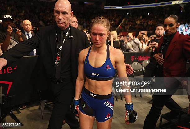 Ronda Rousey exits the Octagon after her loss to Amanda Nunes of Brazil in their UFC women's bantamweight championship bout during the UFC 207 event...