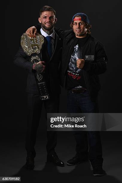 Bantamweight champion Cody Garbrandt poses with Urijah Faber backstage during the UFC 207 event at T-Mobile Arena on December 30, 2016 in Las Vegas,...