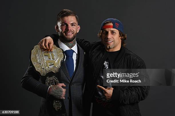 Bantamweight champion Cody Garbrandt poses with Urijah Faber backstage during the UFC 207 event at T-Mobile Arena on December 30, 2016 in Las Vegas,...