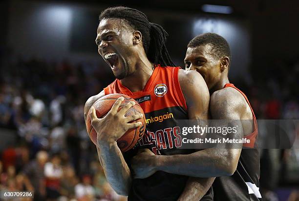 Jameel Mckay of the Willdcats celebrates victory with team mate Casey Prather of the Wildcats during the round 13 NBL match between Illawarra and...