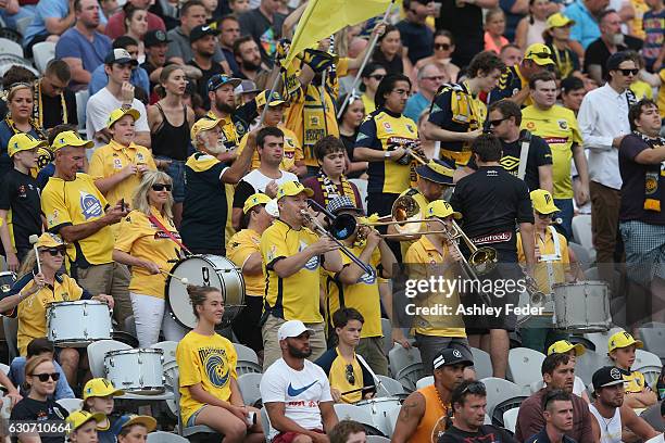 Mariners fans support their team during the round 13 A-League match between the Central Coast Mariners and Melbourne City at Central Coast Stadium on...