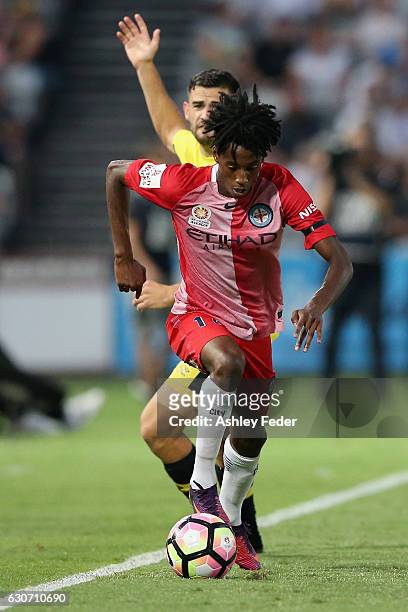 Bruce Kamau of Melbourne City controls the ball ahead of the Mariners defence during the round 13 A-League match between the Central Coast Mariners...