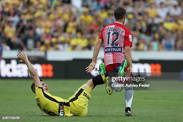 Nick Montgomery of the Mariners collides with Nick Montgomery of Melbourne City during the round 13 A-League match between the Central Coast Mariners...