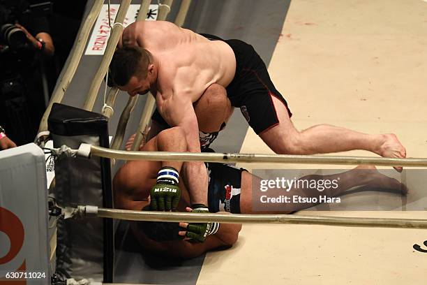 Mirko Cro Cop of Croatia punches Amir Aliakbari of Iran in the Final bout during the RIZIN Fighting World GP 2016 final round at Saitama Super Arena...