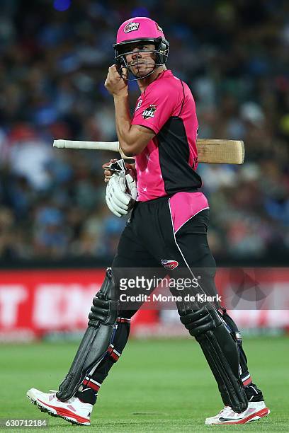 Moises Henriques of the Sydney Sixers leaves the field after getting out to Liam O'Connor of the Adelaide Strikers during the Big Bash League match...