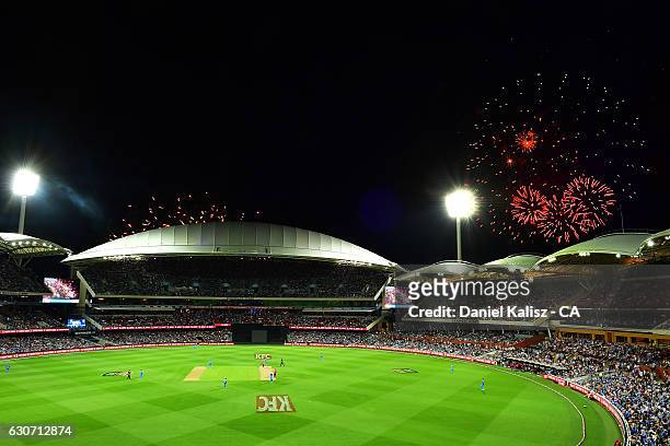 General view of play as fireworks can be seen for new years eve celebrations during the Big Bash League match between the Adelaide Strikers and...