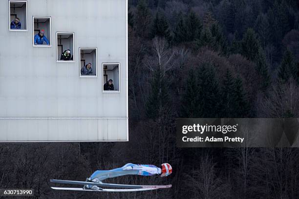 Judges look to Vojtech Stursa of Czech Republic during his qualification jump on Day 1 of the 65th Four Hills Tournament ski jumping event on...