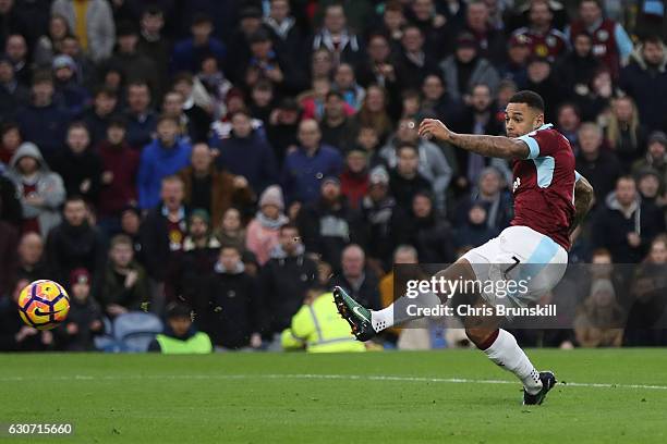 Andre Gray of Burnley scores the opening goal during the Premier League match between Burnley and Sunderland at Turf Moor on December 31, 2016 in...