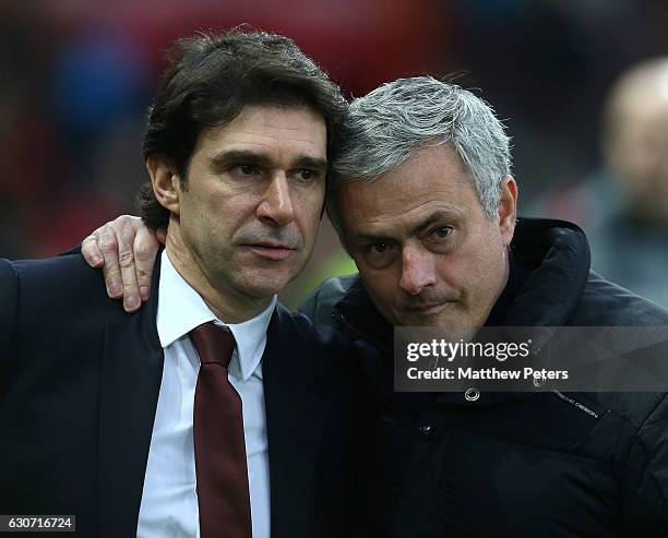 Manager Jose Mourinho of Manchester United poses with Manager Aitor Karanka of Middlesbrough ahead of the Premier League match between Manchester...