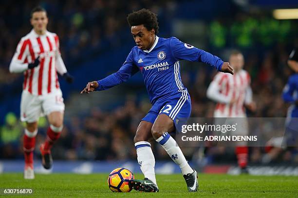 Chelsea's Brazilian midfielder Willian controls the ball during the English Premier League football match between Chelsea and Stoke City at Stamford...