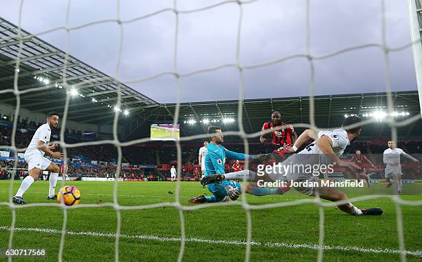 Benik Afobe of AFC Bournemouth scores the opening goal during the Premier League match between Swansea City and AFC Bournemouth at Liberty Stadium on...
