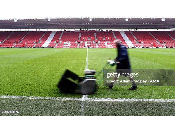 Groundsman gives the pitch a final mow ahead of todays match at St Marys home stadium of Southampton FC during the Premier League match between...