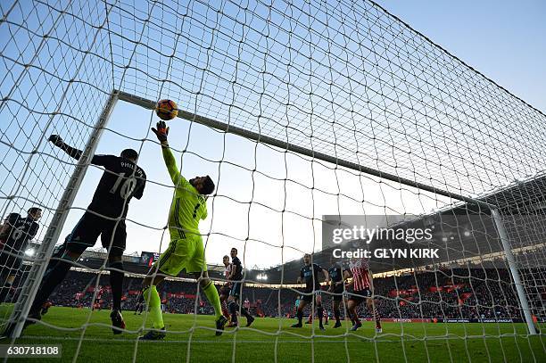 West Bromwich Albion's English goalkeeper Ben Foster dives but fails to save the ball, headed into the goal by Southampton's Irish striker Shane...