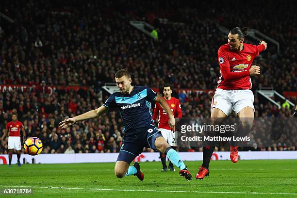 Zlatan Ibrahimovic of Manchester United shoots on goal in front of Ben Gibson of Middlesbrough during the Premier League match between Manchester...