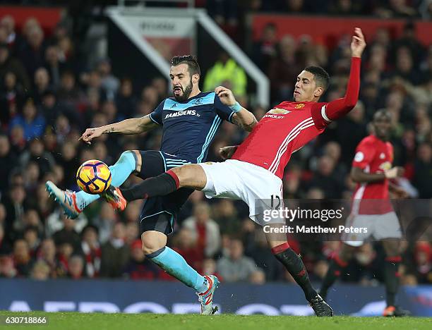 Chris Smalling of Manchester United in action with Alvaro Negredo of Middlesbrough during the Premier League match between Manchester United and...