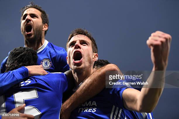 Cesar Azpilicueta and Cesc Fabregas of Chelsea celebrate their side's second goal scored by Willian during the Premier League match between Chelsea...