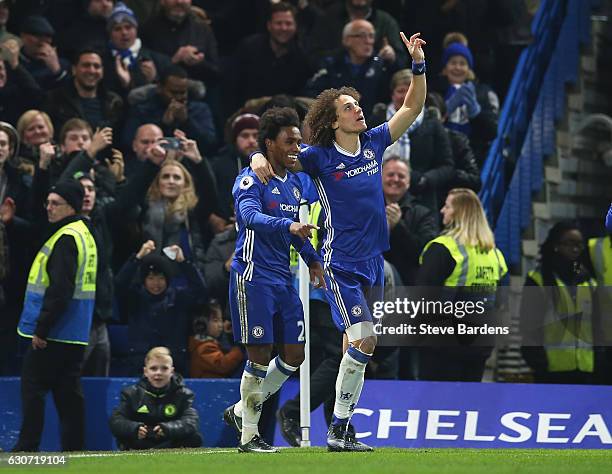 Willian of Chelsea celebrates scoring his team's second goal with his team mate David Luiz during the Premier League match between Chelsea and Stoke...