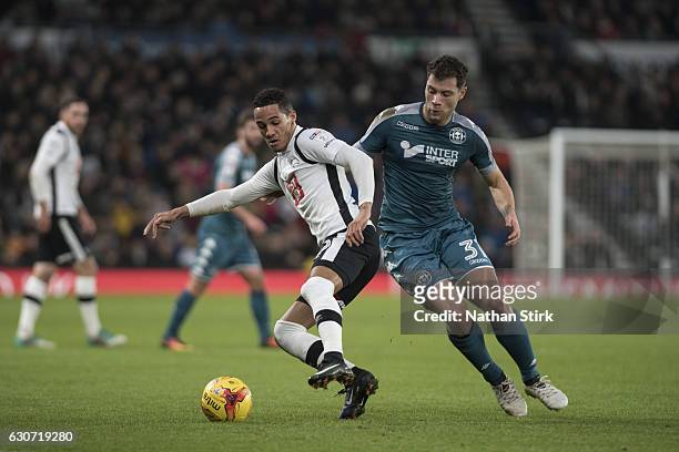 Derby, ENGLANDTom Ince of Derby County and Yanic Wildschut of Wigan Athletic in action during the Sky Bet Championship match between Derby County and...