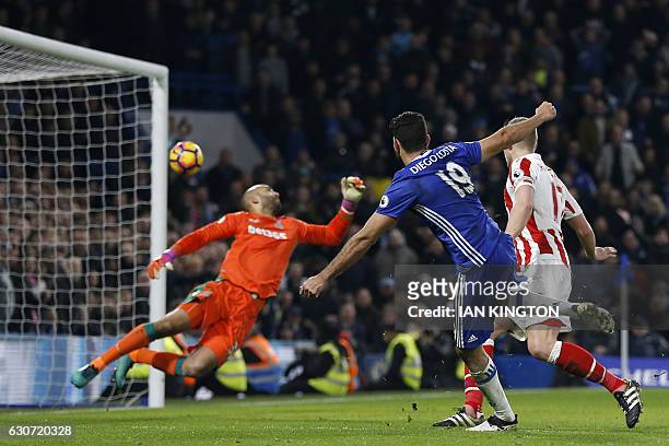 Chelsea's Brazilian-born Spanish striker Diego Costa shoots past Stoke City's English goalkeeper Lee Grant to score their fourth goal during the...
