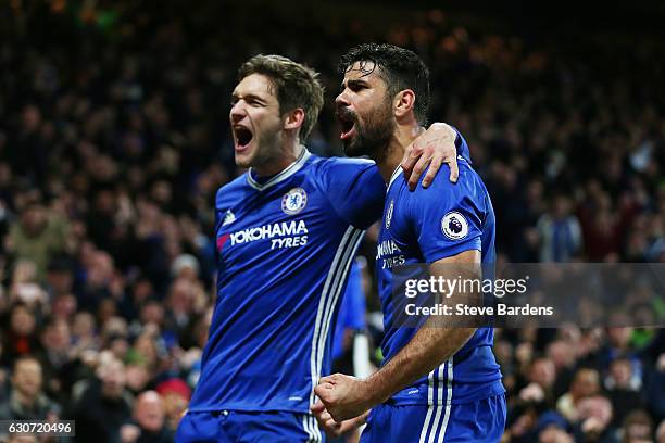 Diego Costa of Chelsea celebrates scoring his team's fourth goal with his team mate Marcos Alonso during the Premier League match between Chelsea and...
