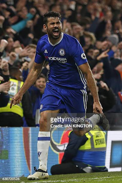 Chelsea's Brazilian-born Spanish striker Diego Costa celebrates after scoring their fourth goal during the English Premier League football match...