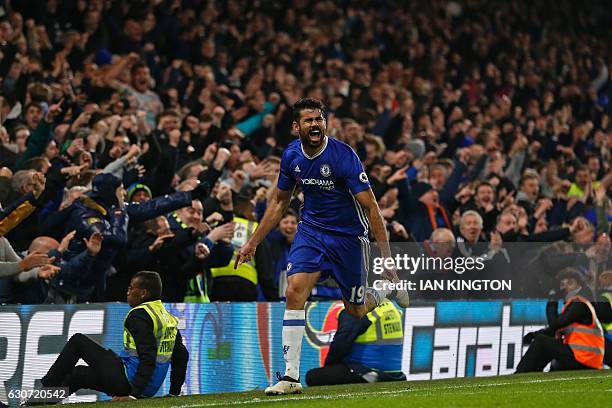 Chelsea's Brazilian-born Spanish striker Diego Costa celebrates after scoring their fourth goal during the English Premier League football match...