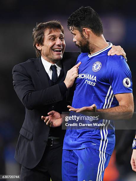 Antonio Conte , Manager of Chelsea congratulates Diego Costa after the Premier League match between Chelsea and Stoke City at Stamford Bridge on...