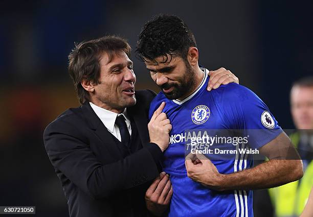 Antonio Conte , Manager of Chelsea congratulates Diego Costa after the Premier League match between Chelsea and Stoke City at Stamford Bridge on...