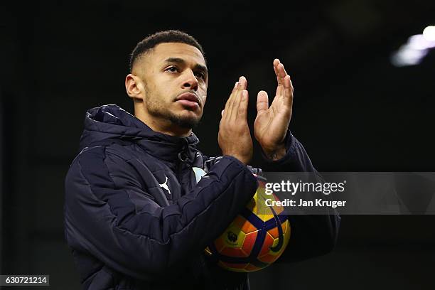 Andre Gray of Burnley applauds supporters with holding the matchball to celebrate his hat tirck after the Premier League match between Burnley and...