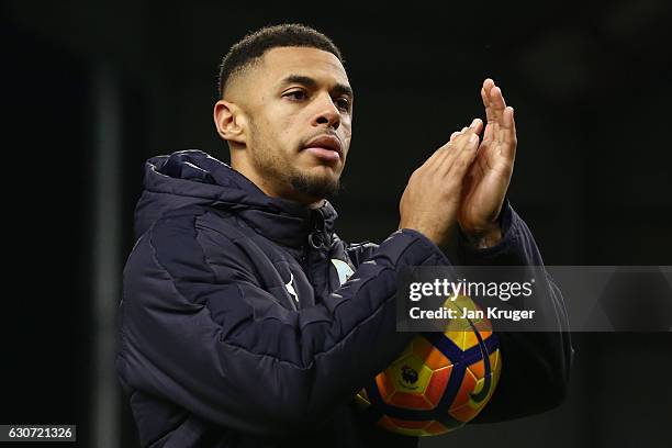 Andre Gray of Burnley applauds supporters as he holds the match ball to celebrate his hat trick after the Premier League match between Burnley and...