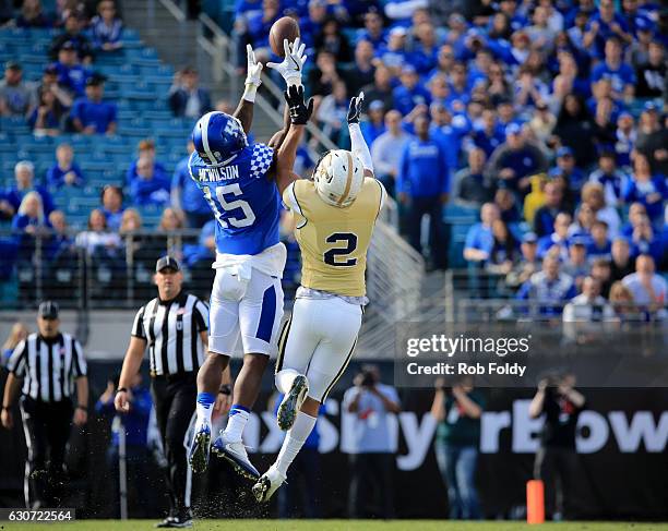 Marcus McWilson of the Kentucky Wildcats attempts to intercept a pass intended for Ricky Jeune of the Georgia Tech Yellow Jackets during the first...