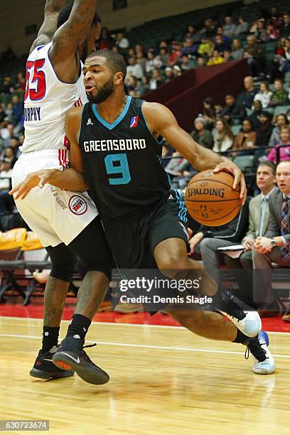 Aaron Harrison of the Greensboro Swarm dribbles the ball against the Grand Rapids Drive at The DeltaPlex Arena on December 30, 2016 in Grand Rapids,...