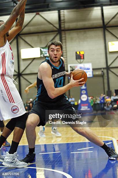 Mike Tobey of the Greensboro Swarm drives to the basket against the Grand Rapids Drive at The DeltaPlex Arena on December 30, 2016 in Grand Rapids,...