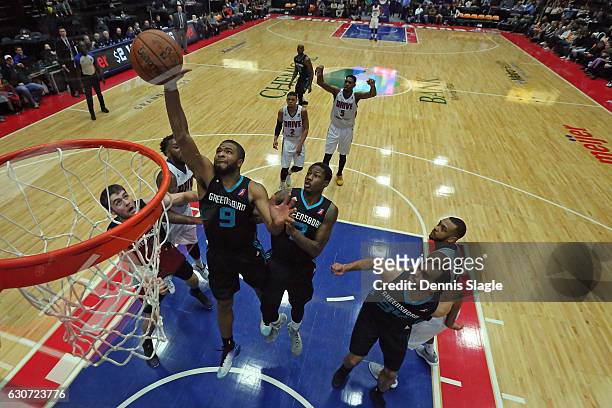 Aaron Harrison of the Greensboro Swarm grabs a rebound against the Grand Rapids Drive at The DeltaPlex Arena on December 30, 2016 in Grand Rapids,...