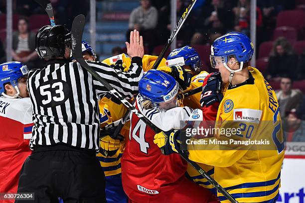 Filip Chlapik of Team Czech Republic and Joel Eriksson Ek of Team Sweden get involved in a scuffle during the 2017 IIHF World Junior Championship...