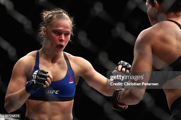 Ronda Rousey and Amanda Nunes of Brazil face off in their UFC women's bantamweight championship bout during the UFC 207 event at T-Mobile Arena on...